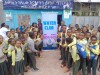 A large crowd of school pupils stand together with Hub researchers around a banner that reads 'Water Club', smiling at the camera thumbnail